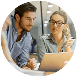 Employees collaborate on a challenges using AI.